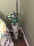 Back up oxygen tank in the corner of the room